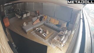 Couple hugging warmly while lying on a sofa, watch