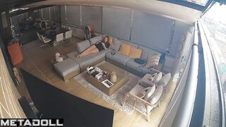 Couple hugging warmly while lying on a sofa, watch