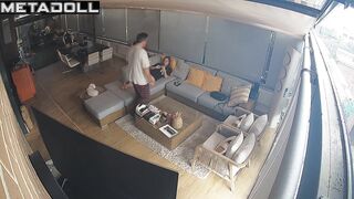 Couple hugging warmly while lying on a sofa, watch