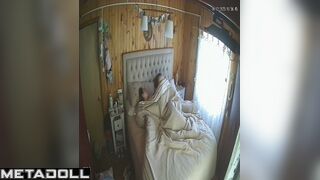 Wife and husband having fun in bed in village house