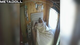 Wife and husband having fun in bed in village house