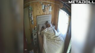 Wife and husband having fun in bed in village house