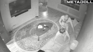 Skinny couple playing with each other on a leather sofa