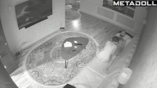 Skinny couple playing with each other on a leather sofa