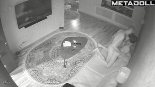 Skinny couple playing with each other on a leather sofa