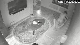 Skinny couple playing with each other on a leather sofa
