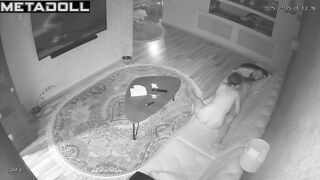 Skinny couple playing with each other on a leather sofa
