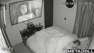 Couple enjoys cozy sex under a blanket in the background of a movie on tv
