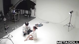 Slim asian girl taking part in a photoshoot for clothing brand