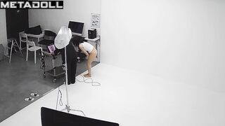 Slim asian girl taking part in a photoshoot for clothing brand