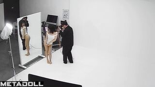 Slim asian girl taking part in a photoshoot for clothing brand