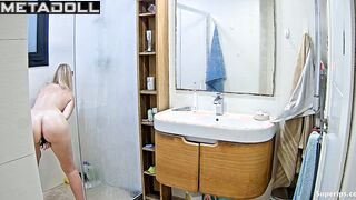 Pretty blonde playing solo game in the shower cabin