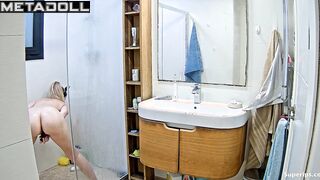 Pretty blonde playing solo game in the shower cabin