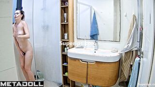 Pretty blonde playing solo game in the shower cabin
