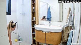 Pretty blonde playing solo game in the shower cabin