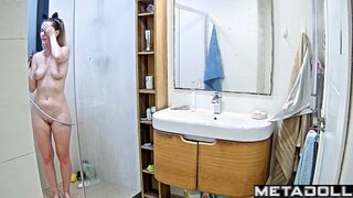 Pretty blonde playing solo game in the shower cabin