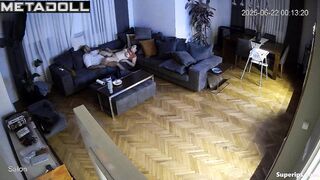Brunette and brunet relaxing in the living room almost naked