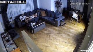 Brunette and brunet relaxing in the living room almost naked