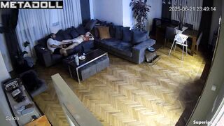 Brunette and brunet relaxing in the living room almost naked