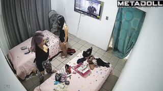 One friend helps another choose an outfit, home scene