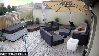 It's raining and they are enjoying each other on the balcony