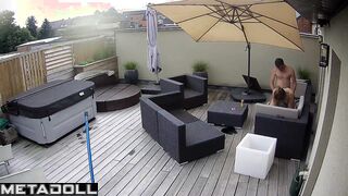 It's raining and they are enjoying each other on the balcony