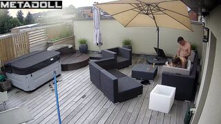 It's raining and they are enjoying each other on the balcony