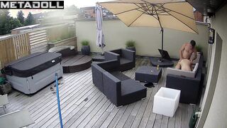 It's raining and they are enjoying each other on the balcony