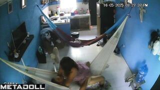 They hung two hammocks in the living room for sex games
