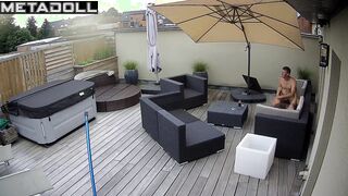 Spouses kissing on the balcony by the break of day