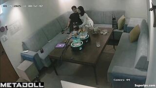 The young couple kissed and teased each other in the restaurant