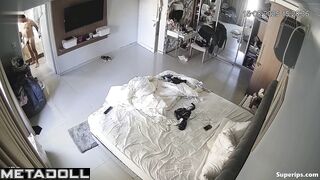 Naked couple relaxing on the bed, unaware of the storm brewing outside