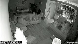Couple fooling around on the sofa, forgetting the ticking clock