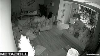Couple fooling around on the sofa, forgetting the ticking clock