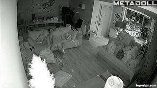 Couple fooling around on the sofa, forgetting the ticking clock
