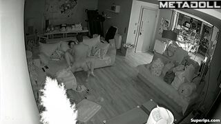 Couple fooling around on the sofa, forgetting the ticking clock