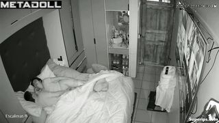 Couple whispers quietly, forgetting the silence in the room