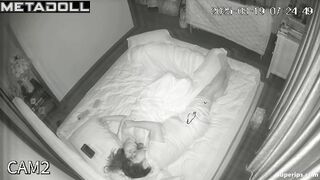 Couple laughs in bed, unaware of the late hour passing outside