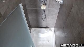 Completely naked Asian girl in the shower lathers her seductive body