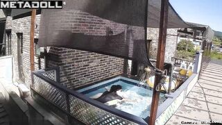 Asian couple enjoying swimming together (inflatable pool in the yard)