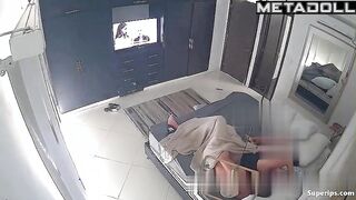 They fuck, not paying attention to the TV that is on