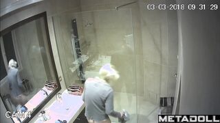 A skinny young blonde with small seductive tits takes a shower