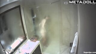 A skinny young blonde with small seductive tits takes a shower