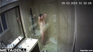 Cute milf washes her tender big tits while taking a shower