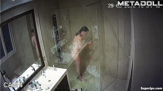 Cute milf washes her tender big tits while taking a shower