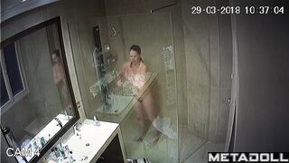 Cute milf washes her tender big tits while taking a shower
