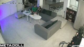 Sexual entertainment of a young couple on a large sofa