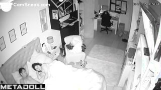 A seductive wife plays with her bored husband's penis while watching TV