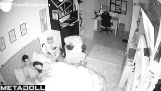 A seductive wife plays with her bored husband's penis while watching TV
