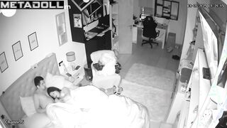 A seductive wife plays with her bored husband's penis while watching TV